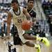 EMU freshman Jalen Ross gets around a Purdue defender in the second half of the game on Saturday. Daniel Brenner I AnnArbor.com